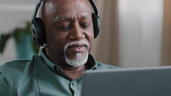 Portrait Old Bald African Businessman with Gray Beard Aged Male in Headset Teacher in Headphones alt