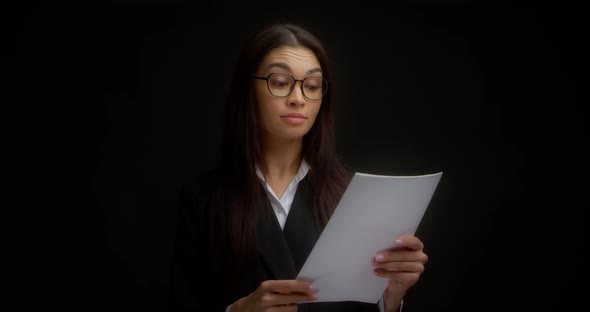 Business Woman Reads the Document Agrees with It and and Gives a Thumbs Up alt