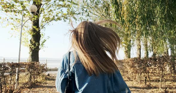 Follow Me, Young Happy Smilling Girl Running and Asking You To Follow Her at Autumn Yellow Park