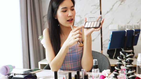 Portrait of young asian Fashion blogger woman review product, alt