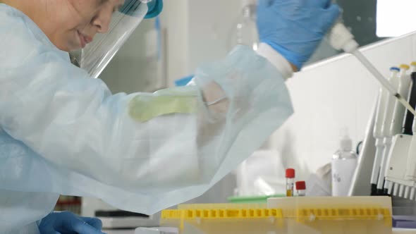 Back View of Female Scientist in Medical Uniform in Research Laboratory alt