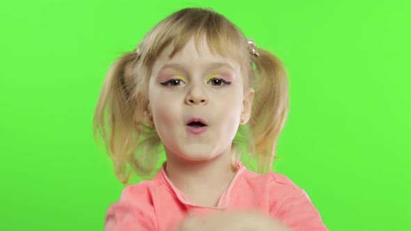 Positive Girl Emotionally Make Faces and Smile in Pink Blouse alt