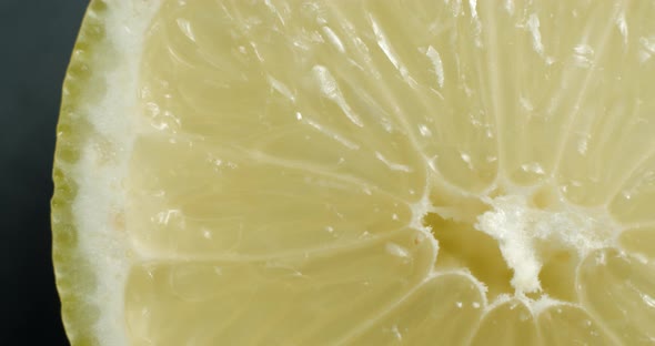 Sliced lemon rotating close up