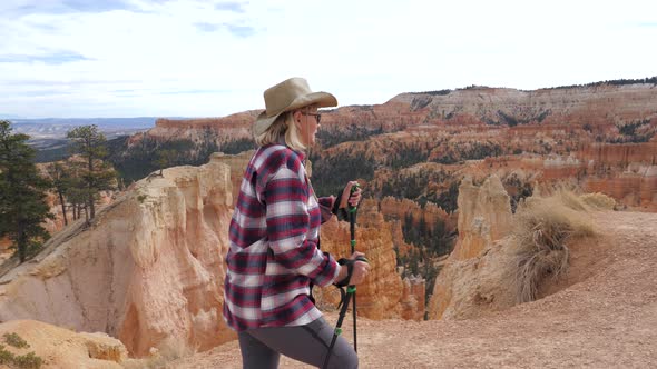 Adult Woman Hiking In The Rocks Of Bryce Canyon alt