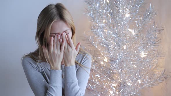 Beautiful Background and a Young Girl Who Rubs Her Eyes with Her Hands