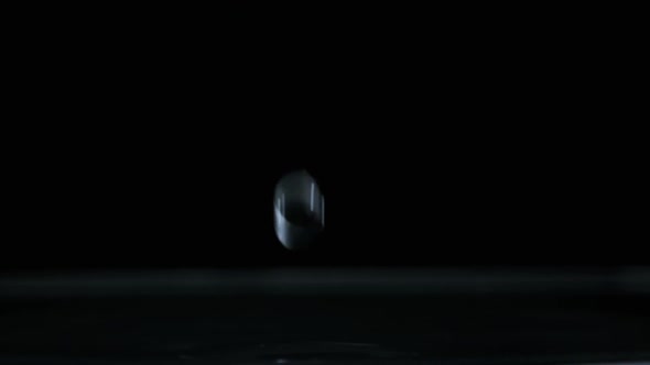 Drop of Water Falls on the Water Surface in Slow Motion Macro Shot alt