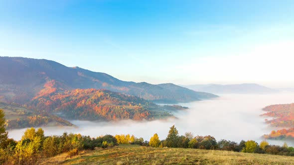 Morning Mist Over the Valley Among the Mountains in the Sunlight. Fog and Beautiful Nature of alt