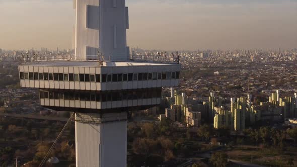 Cinematic aerial drone shot of tallest Tower in Buenos Aires City at sunset - tele lens alt