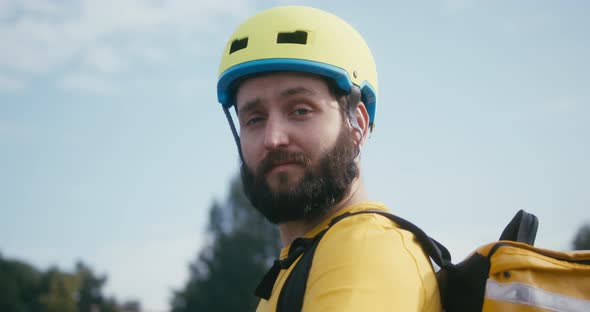 Delivery Man Looking at Camera alt