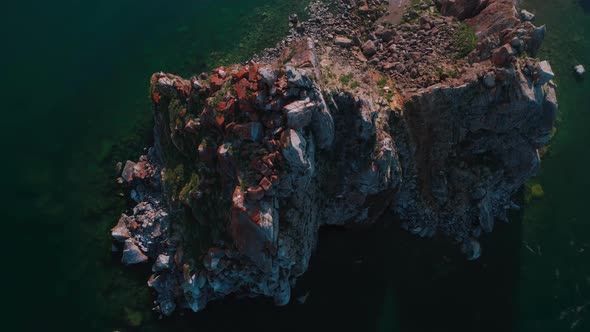 Aerial Drone Footage. Summer. Lake Baikal. Olkhon Island. Rocks in the Siberia. Cape Burkhan alt