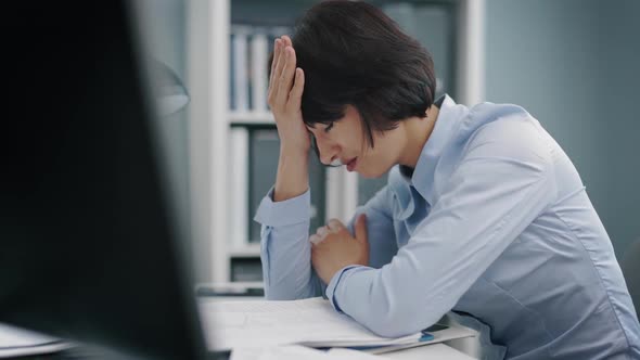 Tired Woman at Office alt