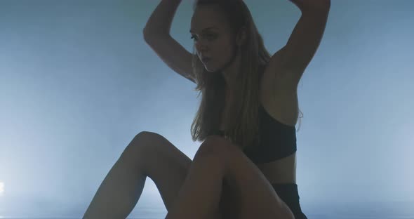 Portrait of Contemporary Art Dancer Resting After Dance Preformance in Dance Studio