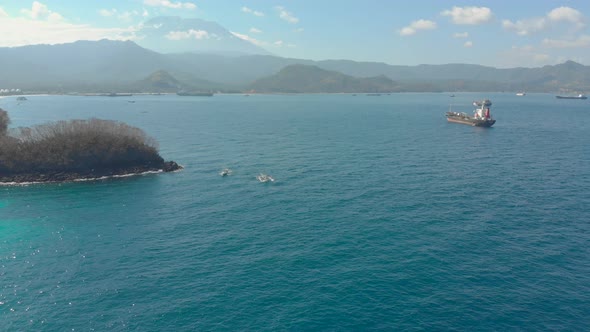 Aerial Shot of Traditional Balinese Boats in an Open Sea. Travel To Indonesia Concept alt