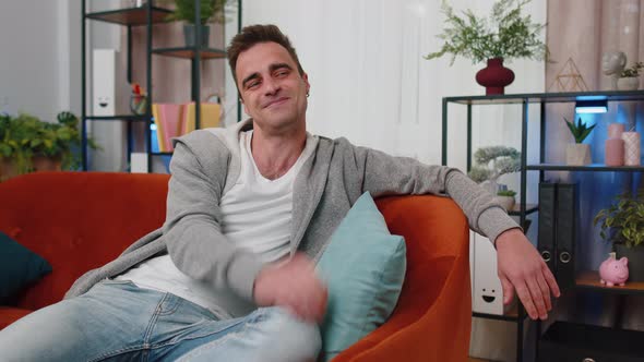 Happy Calm Caucasian Man Smiling Looking Away Dreaming Resting Good News Feel Satisfied at Home alt