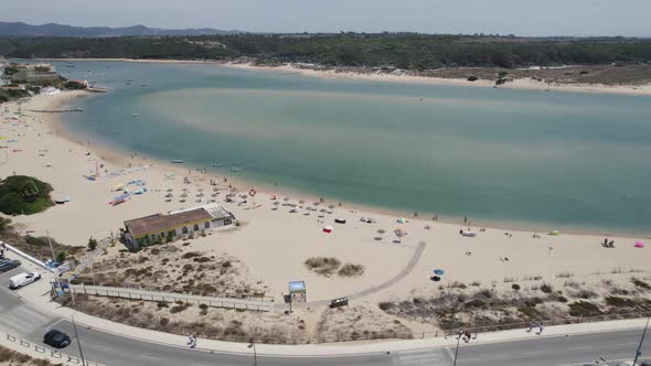 Idyllic Praia da Franquia on bank of Mira River estuary, Portugal; drone alt
