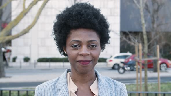 Beautiful Smiling African American Woman Looking at Camera alt