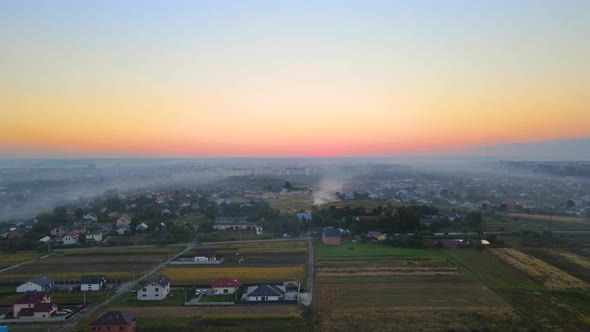 Aerial View of Agricultural Waste Bonfires From Dry Grass and Straw Stubble Burning with Thick Smoke alt