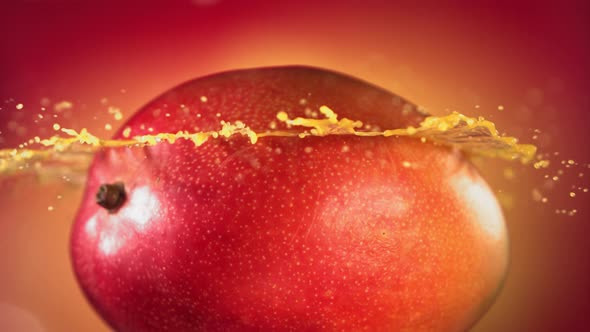 Mango Slice Falling and Splashing on Yellow Pink Background alt