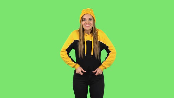 Modern Girl in Yellow Hat in Anticipation of Worries, Then Disappointed and Upset. Green Screen alt
