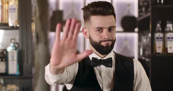 Bartender Is Saying "Stop" Waving His Head alt