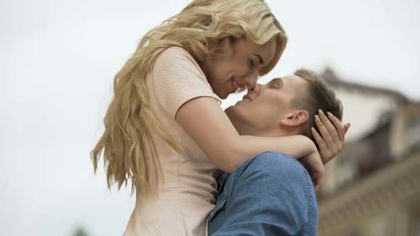 Boyfriend Raising His Girlfriend up And Kissing Her, Passionate Relationship alt