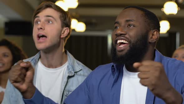 Sport Supporters Yelling and Clapping Hands at Home, Cheering for Team Victory alt