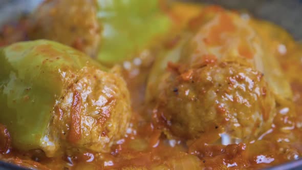 Stuffed Bell Peppers in a Pan Fried in Tomato Sauce