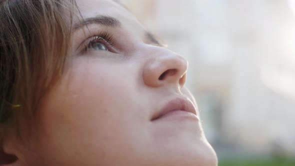 Close Up Face of Young Woman Enjoying Nature Dreaming Praying Looking Up alt