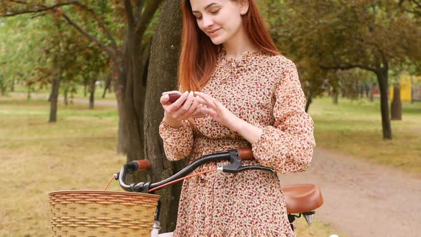 Woman Uses Her Phone to Communicate with Friends Texting Social Media and 4g 5g of Internet alt