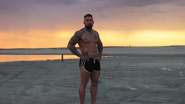 Masculine Man on Shore at Sunset