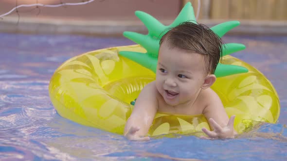 Cute Asian Little Boy In The Pool alt