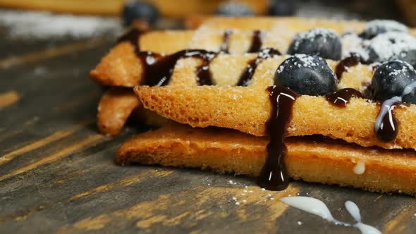 Crispy Belgian Waffles with Blueberries Chocolate Filling and Condensed Milk