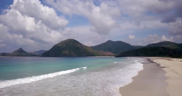 Drone Shot Over Beautiful Beach with Coming Waves alt