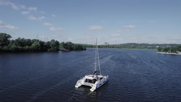 Drone View Big Yacht Sailing the River with a Beautiful View on the Landscape