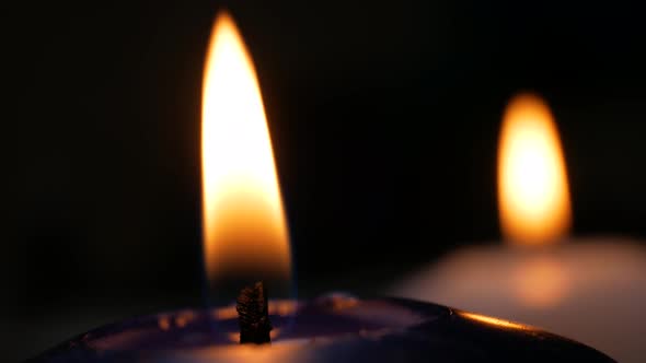 Two White and Blue Candles Flame