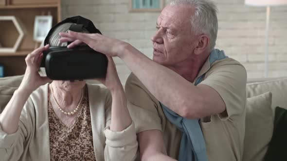 Elderly Couple Trying VR Glasses alt