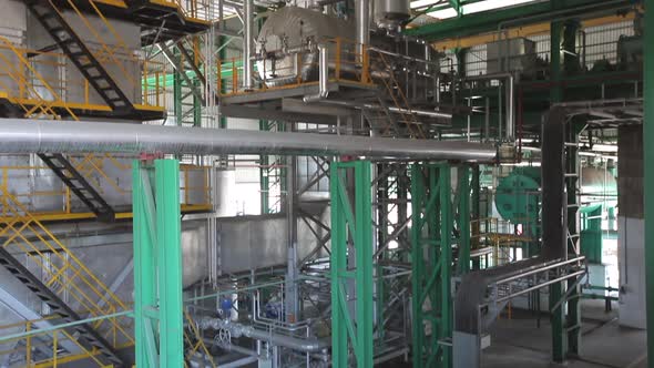 Production machine working and producing a palm oil by a huge machine in Malaysia (Kilang Kelapa Saw alt
