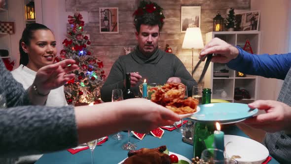 Zoom Out Shot of Big Family Celebrating Christmas alt