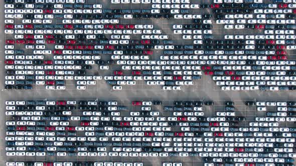 Motion Past Long Rows of Finished Cars in Factory Warehouse alt