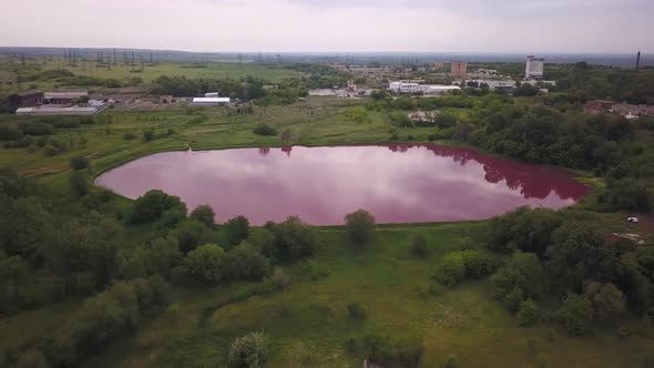 Aerial Landscape with Industrial Zone and Pink Technical Lake