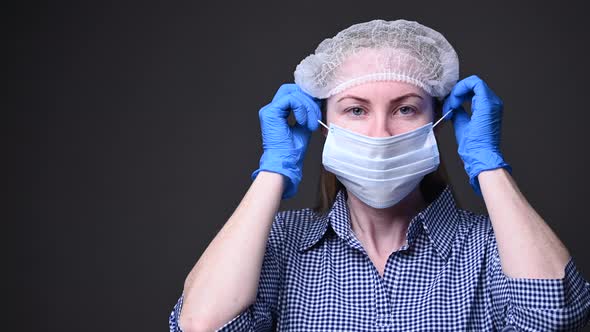 The Girl Takes Off Her Protective Medical Mask. the Covid-19 Virus Epidemic Is Over. Precautions alt