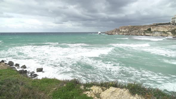 Big Mediterranean Sea Waves Crashing on Shore of one of Malta's Popular Beaches