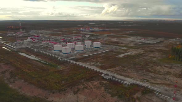 A Drone is Slowly Approaching the Oil and Gas Field alt