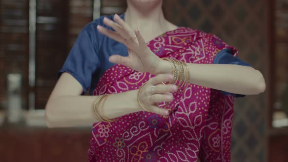 Female Hands in Bracelets Dancing in Indian Style alt