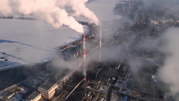 Emission carbon gases from factory pipes with smoke in atmosphere alt