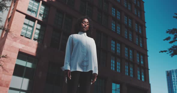 Attractive black woman with confident look to the camera alt