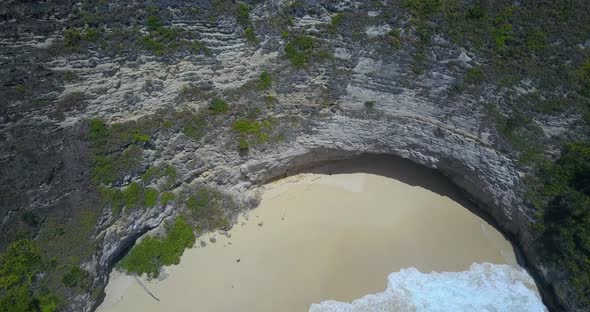 Aerial drone view of a secluded deserted beach coastline. alt