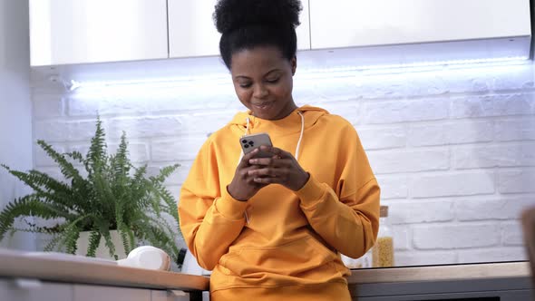 Dancing African American Girl Using Smartphone Pressing Finger Reading Social Media Internet Typing alt