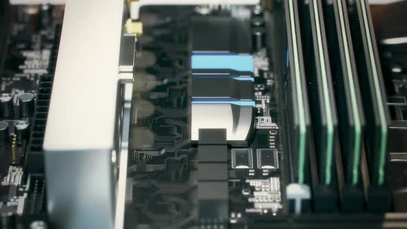 Inserting CPU chips and RAM into motherboard slots and sockets. Loopable shot. alt