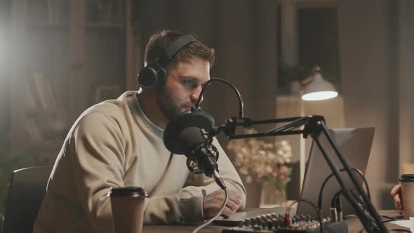 Man Hosting Online Radio Show From Home alt